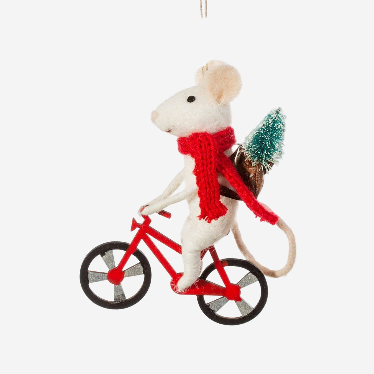Decorative mouse ornament on a bicycle with a red scarf and small tree, hanging against a white background.