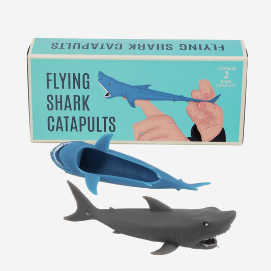 Flying shark catapults with packaging on a white background