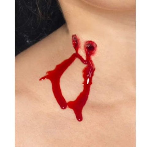Red liquid resembling blood on a person's skin