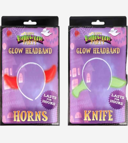 Two Halloween party headwear products in retail packaging on a white background: a red glow horn labeled 'Horns' and a green glow knife labeled 'Knife'. Both packages are purple with 'Happy Halloween Party' branding and show the white headband shape through clear windows.