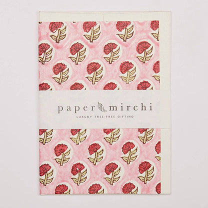 Product packaging with floral design and 'paper mirchi' branding on a light gray background