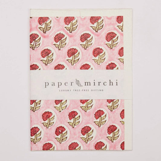 Product packaging with floral design and 'paper mirchi' branding on a light gray background