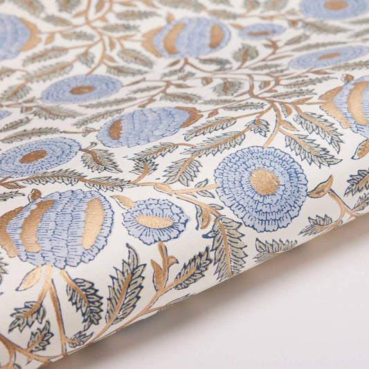 Floral patterned fabric with blue and beige flowers on a white background