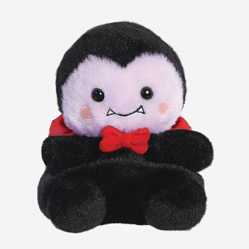 Plush toy of a vampire character with a red bow tie on a white background