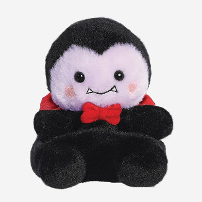 Plush toy of a vampire character with a red bow tie on a white background