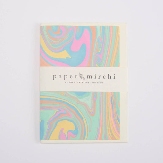 Pack of paper with colorful swirl design on a white background, branded 'paper mirchi'.