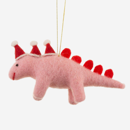 Pink dinosaur ornament with red hats and tail on a white background