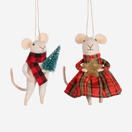 Two Christmas-themed mouse ornaments, one with a plaid scarf and tree, the other in a red dress with a star, on a white background.