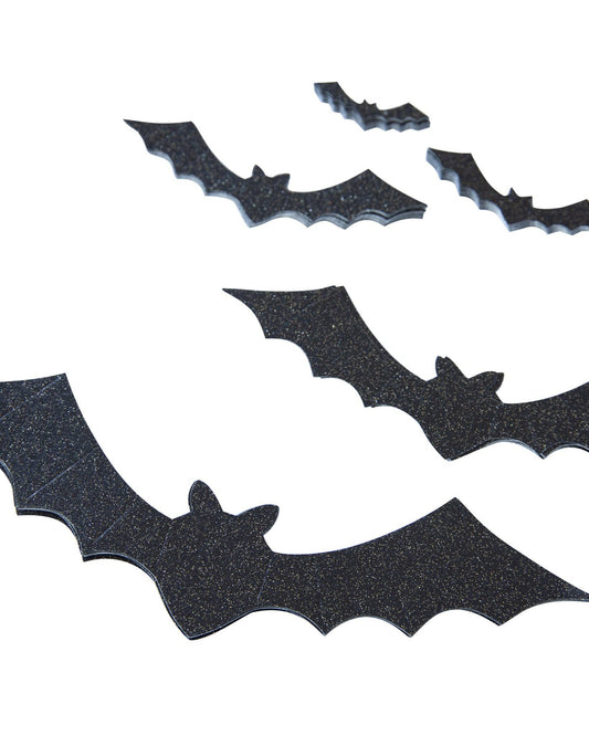 Black glitter bat-shaped wall decals arranged on a plain white background.