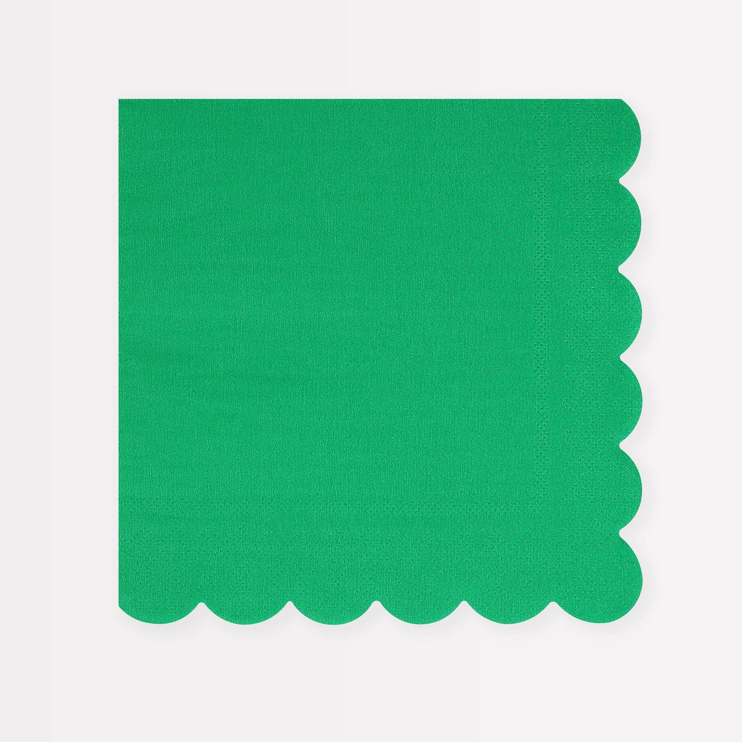Green scalloped-edge napkin on a white background