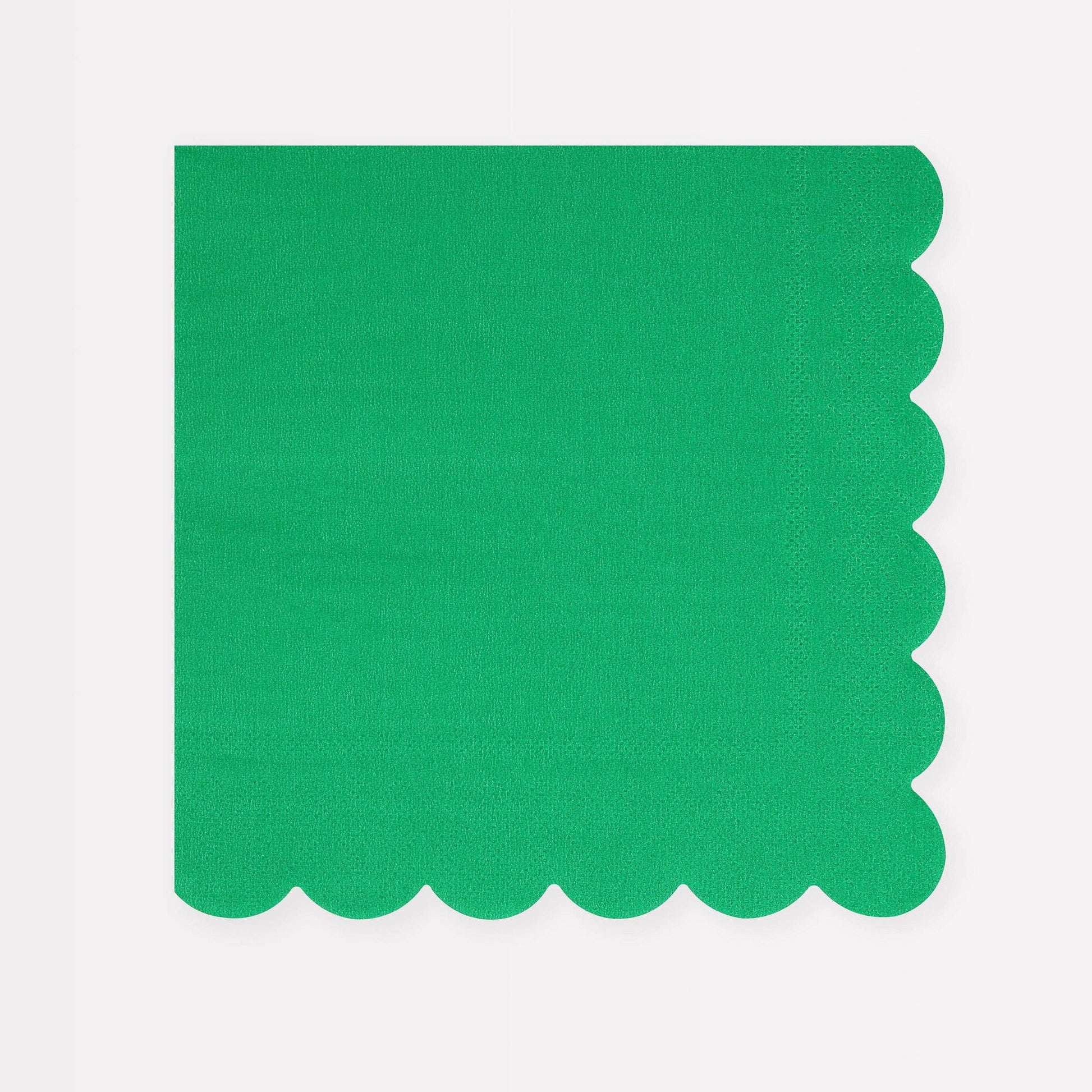 Green scalloped-edge napkin on a white background