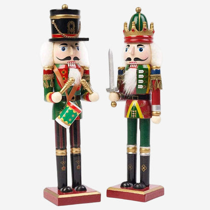 Two decorative nutcrackers with festive attire on a white background