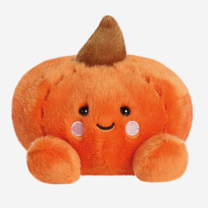 Plush pumpkin toy with a smiling face on a white background