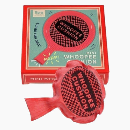 Mini whoopee cushion with packaging featuring the brand 'Rex'.