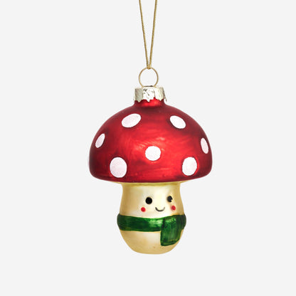 Mushroom-shaped ornament with a red cap and white spots on a white background