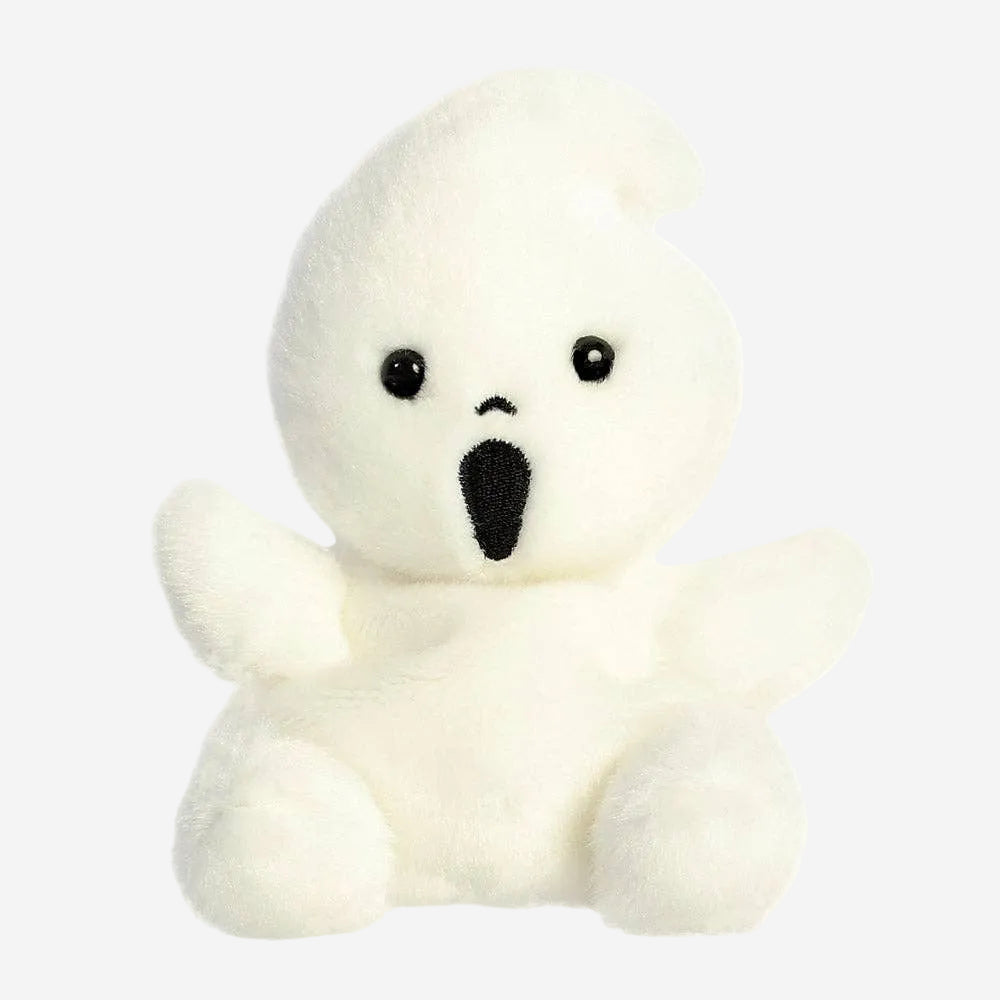 Small white plush toy with black eyes and nose on a white background