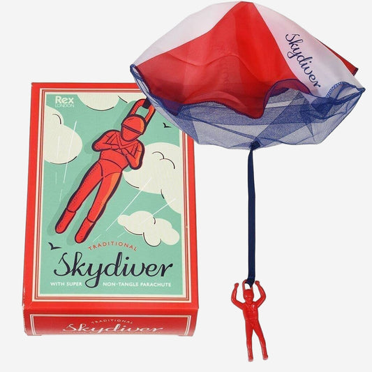 Red skydiver toy with a parachute and its packaging on a white background